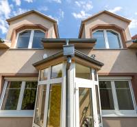 A family house on Bencúrova Street in Bratislava - Ružinov with a glazed veranda and roof.