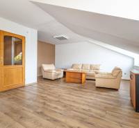 Living room in a family house with solid wood furniture and a floor with a wooden decor.