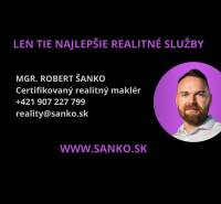 Business card of a certified real estate agent with contact details and a website.