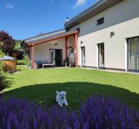 A family house in Kotrčiná Lúčka with a landscaped garden, terrace, and swimming pool in the yard.