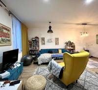 Living room in a family house with a comfortable armchair and decorations on the walls.