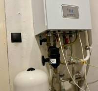 Boiler with piping and expansion tank in a family house.