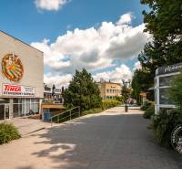 Popradská Street in Stará Ľubovňa with buildings and shops, an ideal walk through a 3-room apartment.