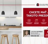 A kitchen in a 3-room apartment with a wooden decor floor; modern furnishings and lighting.