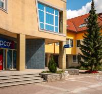 A store on Popradská Street in Stará Ľubovňa with the Pepco logo next to the municipal building.
