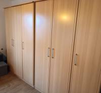 Storage cabinets in a family house, with a wooden decor floor.