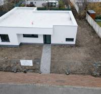 A family house on Sokolia Street in Chorvátsky Grob, surrounded by a garden and a fence.