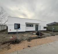 Family house on Sokolia Street in Chorvátsky Grob, being completed, with a fence and building materials.