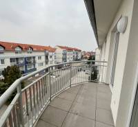 Balcony of a 3-room apartment on Školská Street in Chorvátsky Grob with a view of the surroundings.