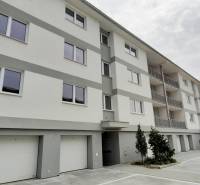 Apartment building on Školská Street in Chorvátsky Grob with parking spaces and garages.