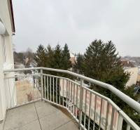 Balcony of a 3-room apartment on Školská Street in Chorvátsky Grob with a view of greenery.
