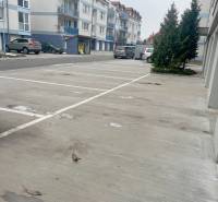 Parking lot at the apartment building on Školská Street in Chorvátsky Grob.
