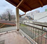 A balcony with tiles and a view of the surroundings in Bratislava - Ružinov on Oriešková Street.