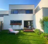 The family house on Radová Street in Nová Dedinka has a well-maintained garden with a lounger.