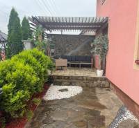 A family house on Strieborná Street in Košice, Barca district, with a landscaped terrace and greenery.