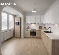 A kitchen in a 3-room apartment with a wood-patterned floor and built-in appliances.