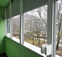 A glazed loggia with a view of the trees from a 3-room apartment on Golianova Street in Trnava.