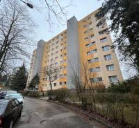 Apartment building on Chabenecká Street in Banská Bystrica with a parking lot and trees.