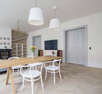 Living room in a 4-room apartment with a wooden decor floor and stylish furniture.