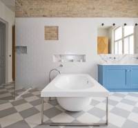 A bathroom in a 4-room apartment with a freestanding bathtub and a blue sink.