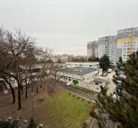 View of the Bratislava - Lúky housing estate, surrounded by greenery and apartment buildings.