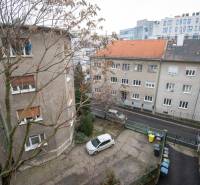 View of Lermontova Street, Bratislava - Old Town, with a parked car in the yard.
