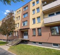 A residential block with a colorful facade on Bratislavská Street in Holíč, offering a 1-bedroom apartment.