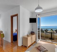Interior of a 3-room apartment with a sea view, floor with wood decor.