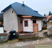 A family house in Jasenica with building materials and wooden decor.