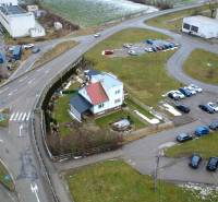 Family house on SNP Street in Považská Bystrica with an adjacent parking lot.
