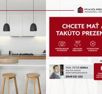 A modern kitchen in a 3-room apartment with an island and appliances, ideal for presentation.