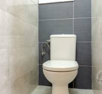A bathroom with tiles in a 3-room apartment.