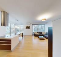 Living room combined with kitchen and wooden decor flooring in a 4-room apartment.