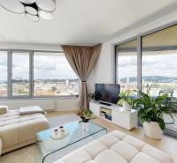 Living room in a 3-room apartment with large windows, view of Bratislava - Old Town.