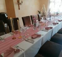 A stylish interior with a table for guests in hotels and guesthouses, decorated with candles and flowers.