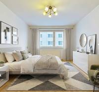 A bedroom in a 3-room apartment with a bed, an armchair, and a floor with a wooden decor.