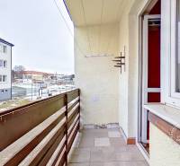 The balcony of a 3-room apartment on Družstevná Street in Podolínec with a view of the neighboring buildings.