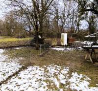 A snowy residential plot on Mierová Street in Krásnohorské Podhradie.