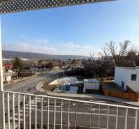 View from the balcony in Bratislava - Dúbravka on Agátová street with a road and houses.