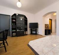 Living room in a family house with a wooden decor floor and modern furniture.