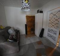 Living room in a family house with a comfortable sofa and decorative lighting.