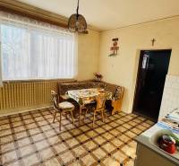 A kitchen in a family house with Italian tiles and white kitchen accessories.