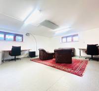 Home office with carpet decor and leather chairs in a family house.