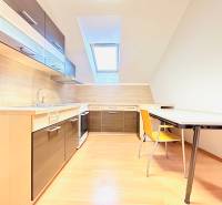 Offices with a kitchen and dining table, light floor with wood decor.