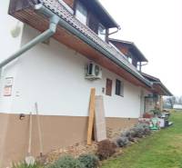 A family house on Cintorínska Street in Divín with a landscaped garden and an attic.
