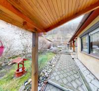 A family house on Hlavná Street in Hronský Beňadik with a terrace, walkway, and garden.