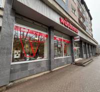 Commercial premises in Poprad with a prominent red logo on the building.