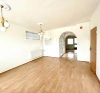 Interior of a family house with a wooden decor floor and decorative lighting.