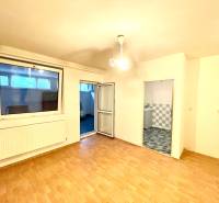 Interior of a family house with a wooden decor floor, view of the room and bathroom.