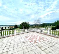 The terrace of a family house on Pútnická Street in Bratislava - Záhorská Bystrica with a view of greenery.